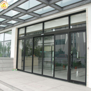 Hurricane Impact Resistant Storefront Doors With Decorative Grilles for Coastal Commercial Buildings